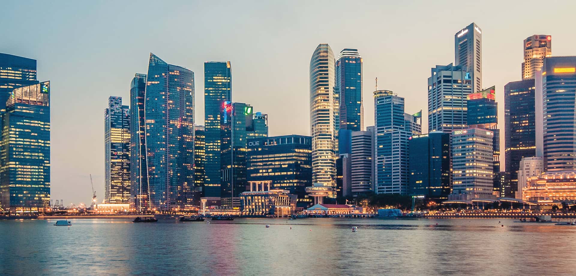 Singapore's Central Business District bank towers across Marina Bay at dusk