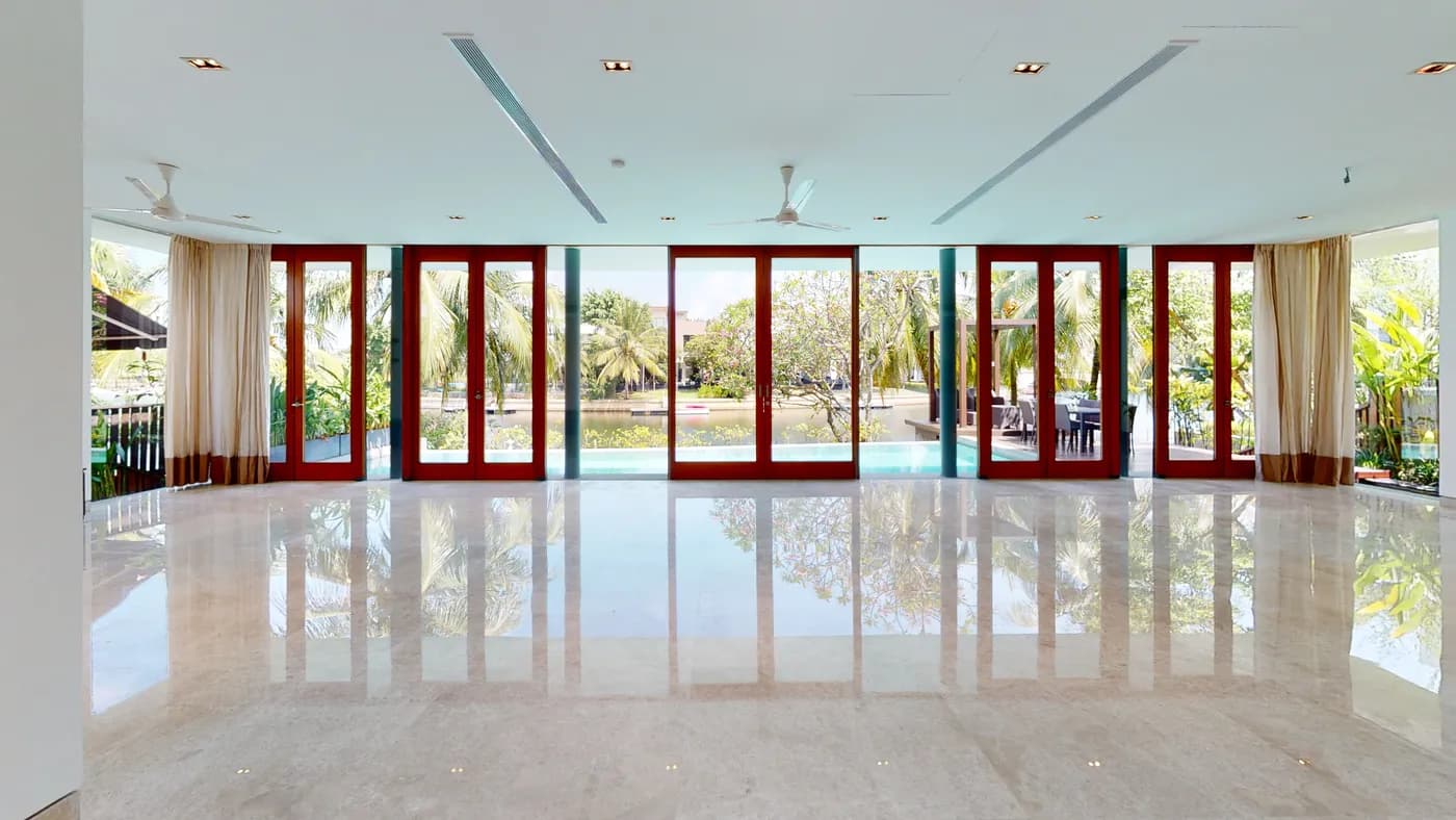 Living and dining room opening to the pool, 168 Ocean Drive