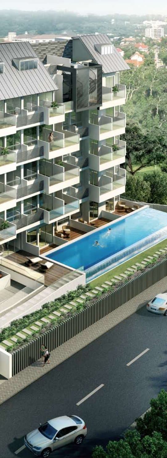 10 Shelford: the block with its balconies and pitched roofs above the pool, beside Shelford Road
