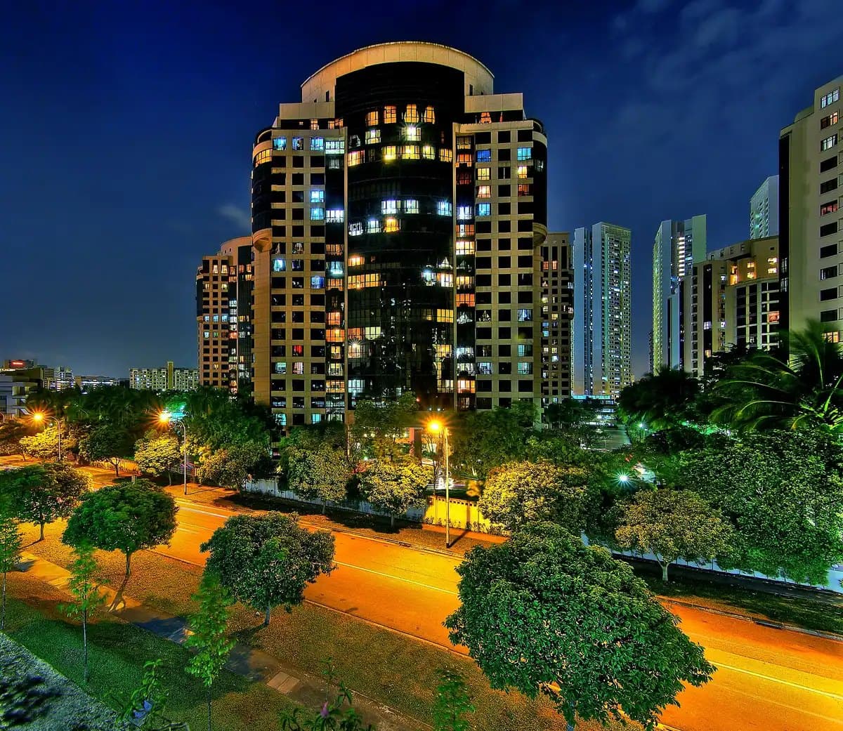 Photo of Heritage View at night: one of its curved 20-storey towers above Dover Rise