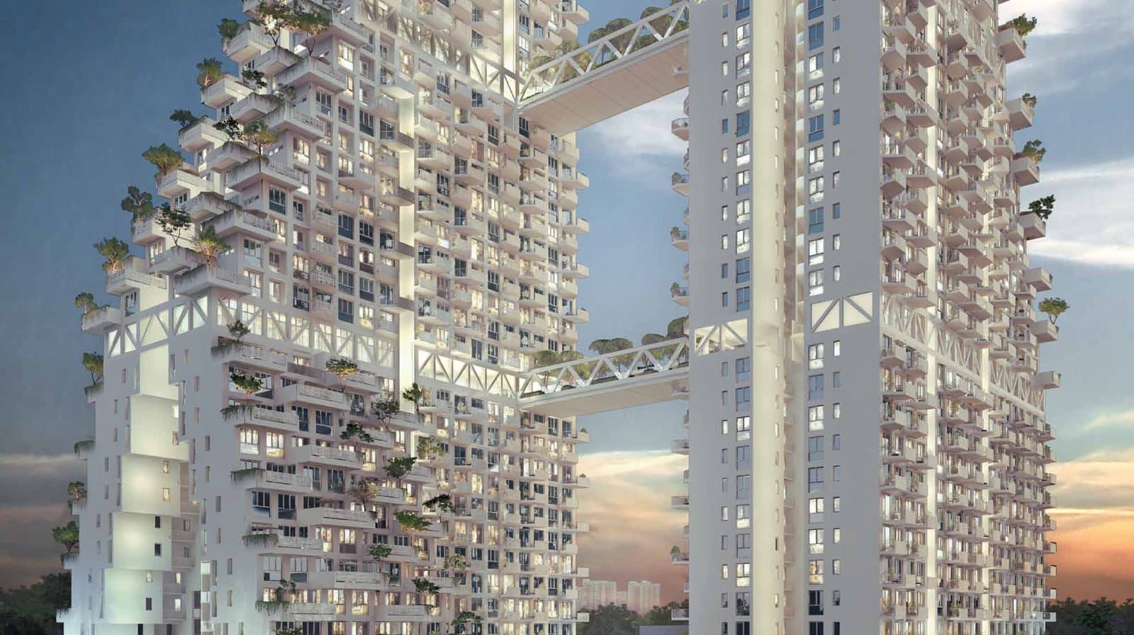 Artist's impression of Sky Habitat at dusk: two stepped white towers of stacked terraces and hanging gardens, joined by three bridges