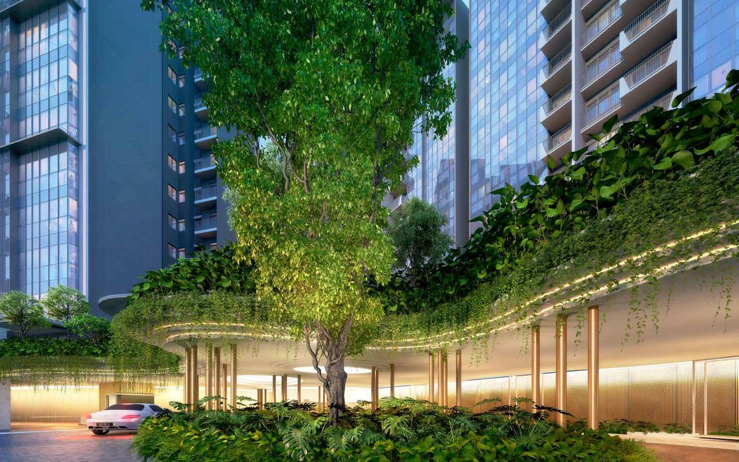 Artist's impression of the drop-off at The Garden Residences at dusk: a tall tree in a planted island under a curved canopy hung with greenery, bronze columns, and the glass and balconies of the 15-storey towers behind
