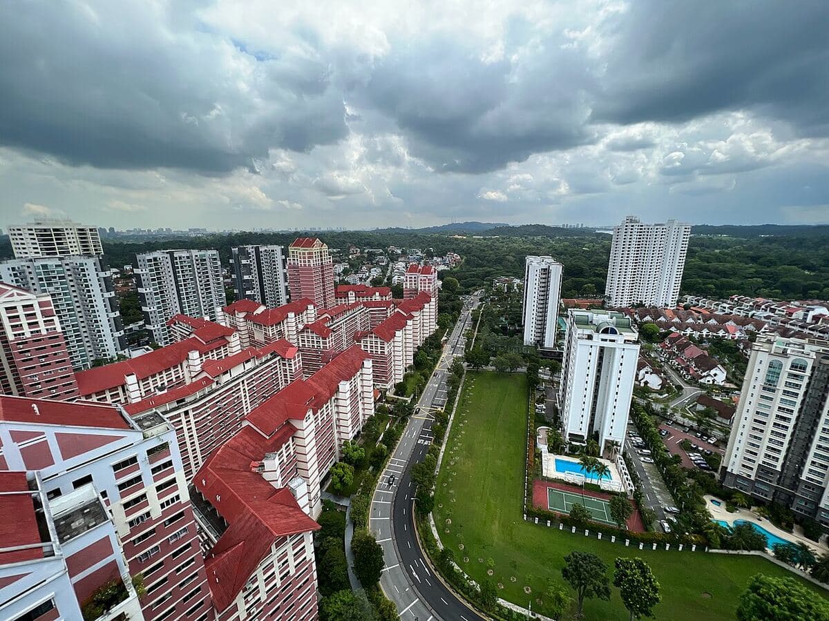 View from a high floor on Sin Ming Avenue across housing blocks to the forest of the Central Catchment Nature Reserve