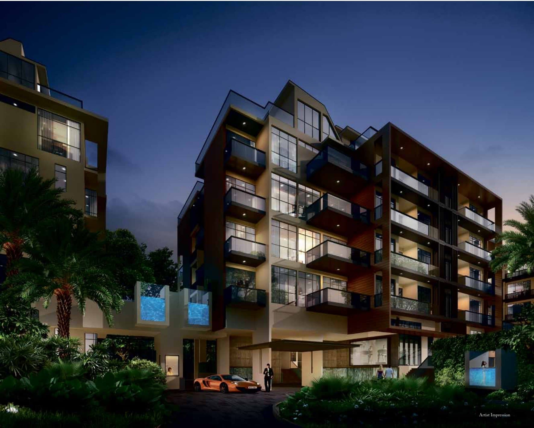 Tropika East: a five-storey block with deep balconies and private pools at the foot, lit at dusk